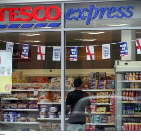 Tesco's profit slide in home market