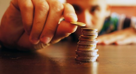 man piling money