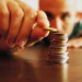 man piling money